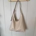 Chic beige faux leather large hobo tote bag with vertical stitching and adjustable strap - White