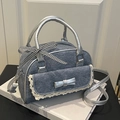 Blue denim mini Boston bag with silver handles and delicate lace bow details - Blue