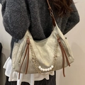 Olive green tote bag with pearl chain and brown leather zipper details on model - Green
