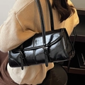 Glossy black patent leather underarm bag with decorative buckles and quilted details - Black