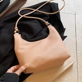 Minimalist beige pebble leather half-moon crossbody bag with decorative knot strap - Khaki