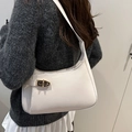 Chic cream leather underarm bag featuring a vintage gold twist lock for a stylish look - White