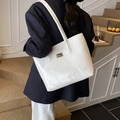 French vintage style white glossy leather shoulder bag worn by model in elegant setting - White without Pendant