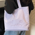 Minimalist lavender tote bag with embroidery featuring star and cloud patterns - Purple