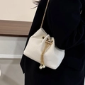 Cream corduroy bucket bag with gold chain strap and pearl drawstring charms - Off White