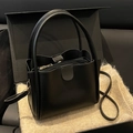 Minimalist black bucket bag with lychee texture and detachable shoulder strap - Black