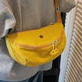 Vibrant yellow crescent nylon crossbody bag with minimalist metal logo and dual zippers - Yellow