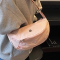 Pale pink crescent nylon crossbody bag with pleated texture and metal logo detail - Pink