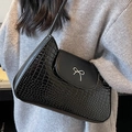 Elegant black crocodile texture underarm bag with a silver metal bow accent - Black