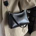 Classic black faux leather shoulder bag with decorative woven strap and gold hardware - Black