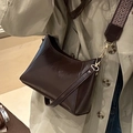 Dark brown faux leather underarm bag with gold hardware and wide woven strap - Dark Brown