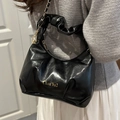 Glossy black pleated handbag with gold chain strap and luxury finish for women - Black