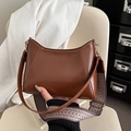 Brown faux leather crescent bag with patterned wide strap and slim shoulder strap - Tan