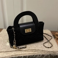 Elegant black quilted bucket bag with golden twist lock and hard circular handle - Black