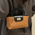 Vintage brown quilted bucket bag with black handle and gold chain strap detail - Brown