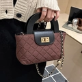 Vintage brown quilted bucket bag with black leather handle and gold chain strap detail - Brown