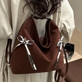 Dark brown suede tote bag with ribbon detail worn over the shoulder for commute - Brown