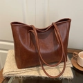 Brown leather large tote bag for women placed on a beige scarf for fall commute - No Pendant / Brown