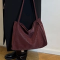 Large burgundy suede tote bag with leopard print detail shown on shoulder for daily commute - Red