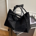 Large capacity black leopard print suede tote bag placed on a silver suitcase - Black