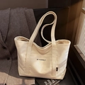 Borsa tote in tela bianco crema con scritta BE YOURSELF e tasca frontale esterna - Cachi