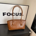 Brown leather tote bag featuring slim knotted shoulder straps and trapezoidal design - Yellow Brown Without Pendant