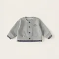 Cardigan in maglia grigia con bordo a quadri blu e ricamo a fiocco per bambina - 90 / Grigio