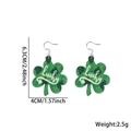 Green glitter shamrock drop earrings with white lucky text and size measurements - Letter Print Shamrock