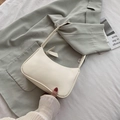 Minimalistische cremeweiße Baguette-Tasche mit dekorativer Schleife und glattem Lederfinish - Weiß