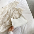 White patent leather baguette bag with crocodile pattern and retro crescent shape - White