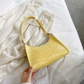 Fashionable bright yellow dumpling shoulder bag with crocodile pattern in glossy finish - Yellow