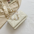 Beige quilted rectangular crossbody bag with golden chain and patterned strap - White