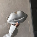 Chic silver lip-shaped crossbody bag with golden chain strap and metallic PU finish - Silver
