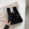 Furry black plush tote bag with soft texture and handles shown on a beige background - Black
