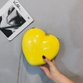 Bright yellow heart-shaped crossbody bag with a glossy finish and fine gold chain strap - Yellow
