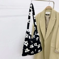 Minimalist faux fur tote bag featuring black and white floral pattern with wide shoulder strap - Black With White Flowers