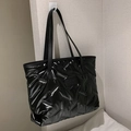 Minimalist black quilted tote bag with FASHION BAGS tag and slim shoulder straps - Black