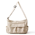 Versatile off-white canvas messenger bag with adjustable strap and multiple pockets - Off White