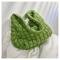 Detailed texture of bright green quilted puffy cloud tote bag with soft wide handle - Green