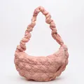 Modern pink quilted hobo bag featuring a stylish ruched strap and diamond texture - Pink