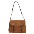 Vintage brown suede shoulder bag with leather straps and metal buckles on white background - Tan