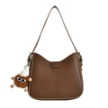 Brown PU leather crescent shoulder bag featuring a cute plush pendant accessory - Brown