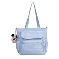 Light blue nylon tote bag with front flap pocket and cute puppy plush keychain - Blue