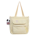 Chic creamy yellow nylon tote bag with a cute white puppy plush keychain and embroidery - Yellow