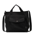Bolso de lona negra minimalista con correa ajustable y detalle de etiqueta fashion - Negro