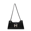Fashionable black PU leather shoulder bag with a metallic silver bow on the front flap - Black