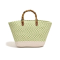 Green and cream woven tote bag featuring dark brown bamboo handles and silver metal studs - Green