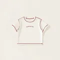 Cremeweißes Kinder Kurzarm-T-Shirt mit roten Kontrastnähten und Grafik-Aufdruck - 80 / Weiß