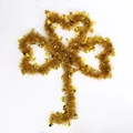 Golden St. Patrick's Day tinsel garland with clover sequins on a white background - 2m Gold Shamrock Garland