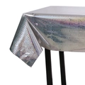 Macro detail of holographic silver wavy tablecloth showing reflective PVC texture and edge - 100cmx270cm / Silver